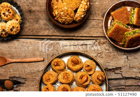 Arabic desserts in rustic bowls top view 51127490