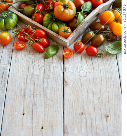 Colorful tomatoes on a wooden table 51134079
