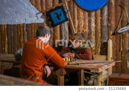 Two men playing popular strategy board game - tafl 51135680