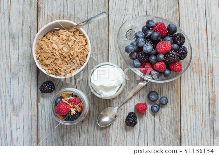 Healthy breakfast with Fresh greek yogurt, flakes  51136134