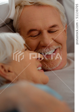 Face-portrait of white-haired vigorous man looking at silver-haired beautiful wife Face-portrait of white-haired vigorous man looking at silver-haired beautiful wife 51138705
