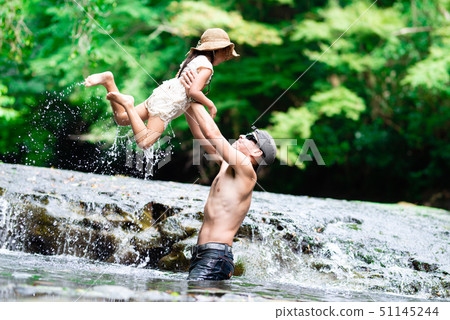 Father and daughter play river 51145244