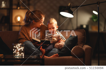 Family before going to bed mother reads to her 51150094