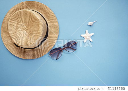 hat smartphone and sunglasses blue background 51158260