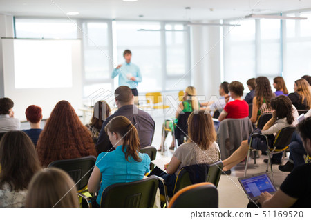 Speaker giving presentation on business conference meeting. Speaker giving presentation on business conference meeting. 51169520