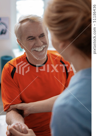 Delighted aged man being in a positive mood Delighted aged man being in a positive mood 51186436