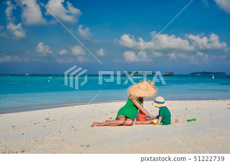 Woman in green dress with three year old boy on 51222739