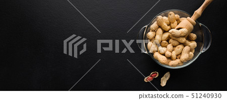 Bowl with peanuts on black Bowl with peanuts on black 51240930