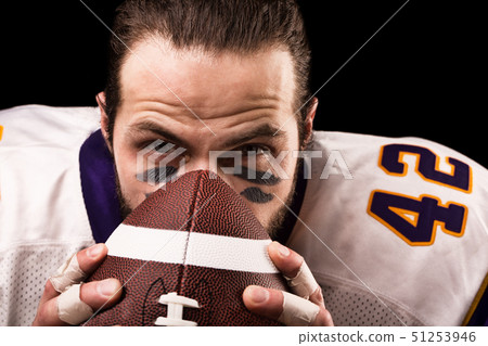 Sports concept. American football player on black with ball. Sports concept. close-up 51253946