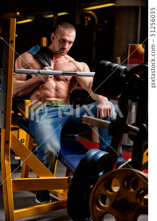 handsome athlete with perfect torso posing on camera handsome athlete with perfect torso posing on camera 51256035