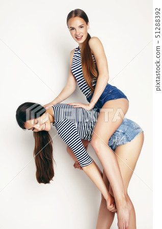 best friends teenage girls together having fun, posing emotional on white background, besties happy best friends teenage girls together having fun, posing emotional on white background, besties happy 51288392