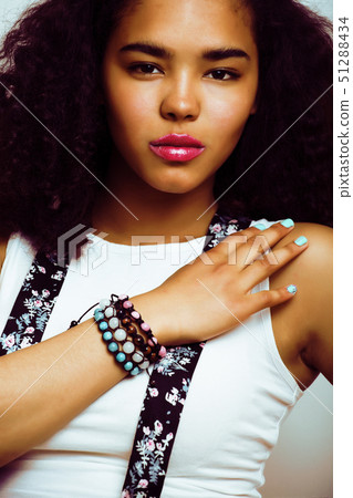 young pretty african american girl emotional posing on white background, lifestyle peopleconcept young pretty african american girl emotional posing on white background, lifestyle peopleconcept 51288434