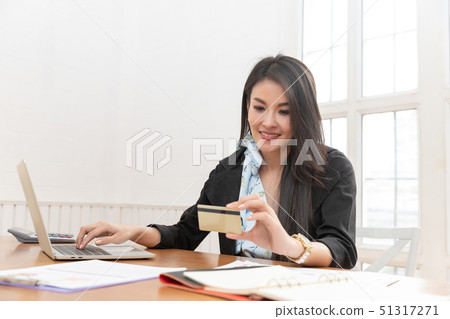 Freelancer business woman holding credit cart to 51317271