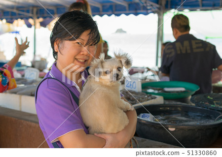 Thai woman shopping a seafood in market Thai woman shopping a seafood in market 51330860