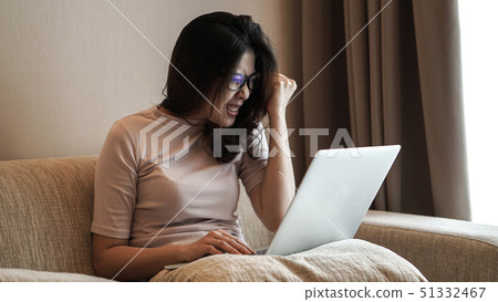 Asian freelamce woman work at home with computer Asian freelamce woman work at home with computer 51332467