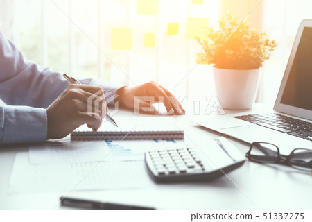 Accountant counts tax, works in the office Accountant counts tax, works in the office 51337275
