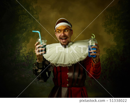 Young man as a medieval knight on dark background Young man as a medieval knight on dark background 51338022