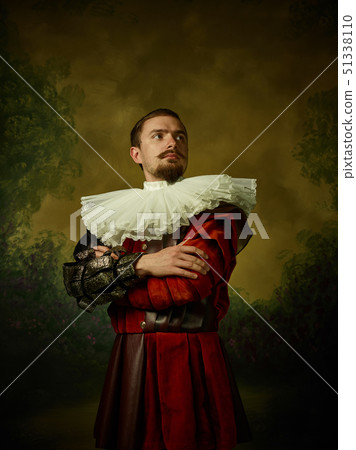 Young man as a medieval knight on dark background Young man as a medieval knight on dark background 51338110