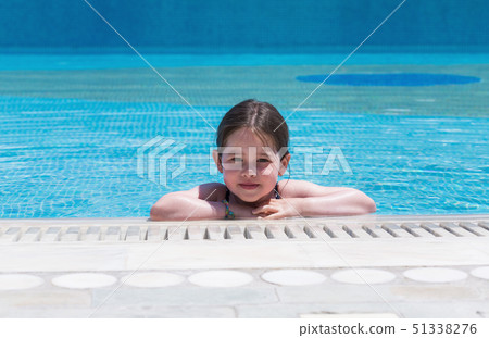 Little cute girl swimming in a pool 51338276