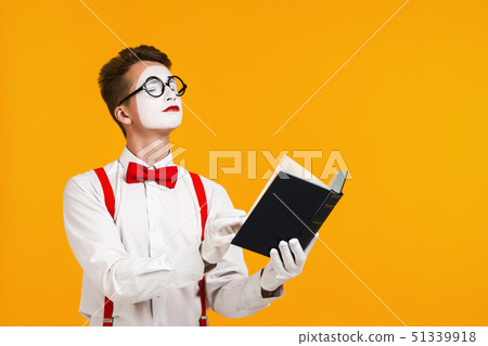 portrait of mime man artist with book 51339918