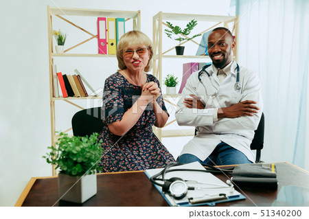 A senior woman visiting a therapist at the clinic 51340200