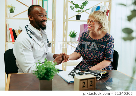 A senior woman visiting a therapist at the clinic 51340365