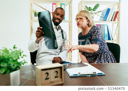 A senior woman visiting a therapist at the clinic 51340470