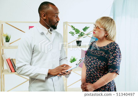 A senior woman visiting a therapist at the clinic 51340497