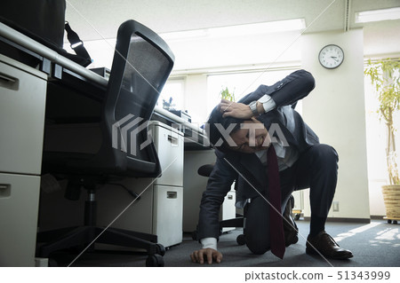 Businessman falling down at work 51343999