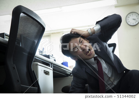 Businessman falling down at work Businessman falling down at work 51344002
