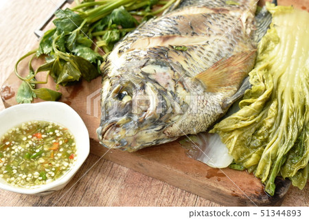 steamed mango fish with vegetable dipping sauce 51344893