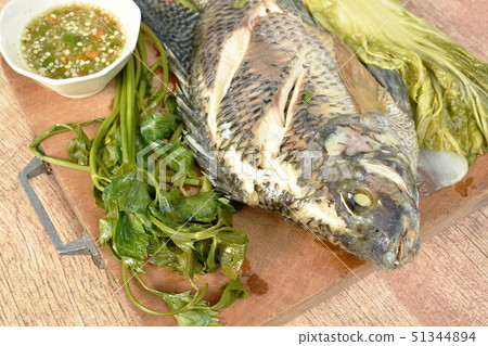 steamed mango fish with vegetable dipping sauce 51344894