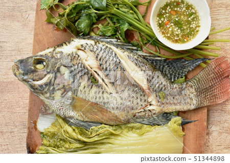 steamed mango fish with vegetable dipping sauce 51344898