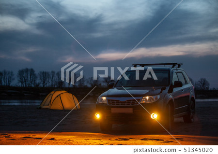 Camping at sunset on a sand river bank Camping at sunset on a sand river bank 51345020