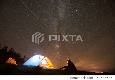 Night summer camping in the mountains under night starry sky Night summer camping in the mountains under night starry sky 51345376
