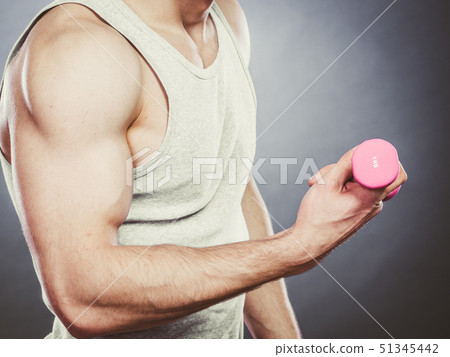 Funny sporty fit man lifting light dumbbell. Fun. 51345442
