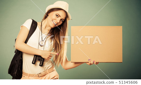 Summer traveler woman hitchhiking with blank sign Summer traveler woman hitchhiking with blank sign 51345606