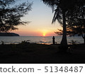 Girl and the sun setting in the sea (bright) 51348487