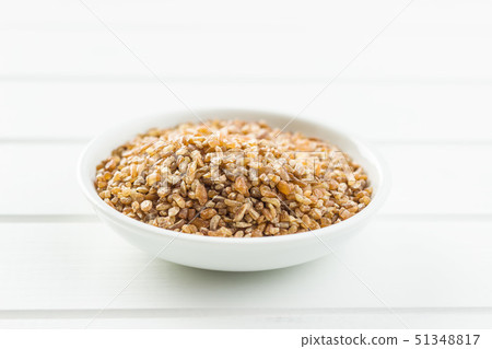 Dry bulgur wheat grains. Dry bulgur wheat grains. 51348817