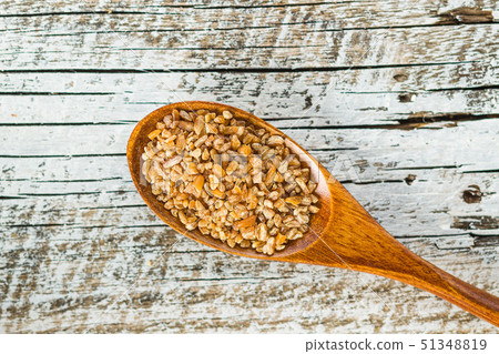 Dry bulgur wheat grains. Dry bulgur wheat grains. 51348819