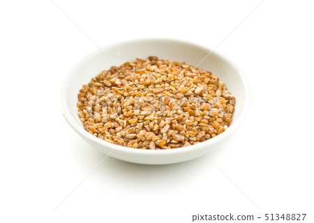 Dry bulgur wheat grains. 51348827
