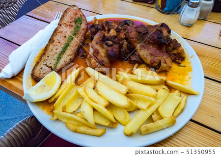Plate of pig's feet with grapes with a slice of Plate of pig's feet with grapes with a slice of 51350955