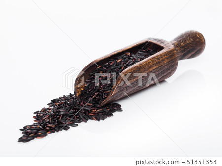 Wooden spoon of raw organic black venus rice on 51351353