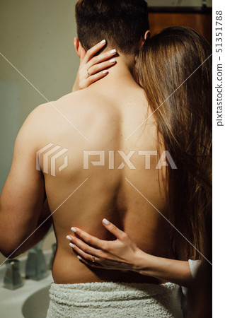 A lovely couple spends pleasant moments in the bathroom. Gently hugging 51351788
