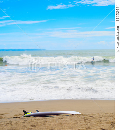 Surfboard on sandy beach Surfboard on sandy beach 51352424