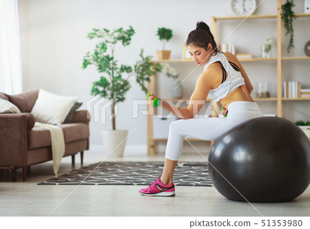 young woman doing fitness and sports at home . young woman doing fitness and sports at home . 51353980