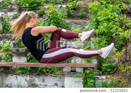 Fitness lifestyle. Young woman warming up Fitness lifestyle. Young woman warming up 51355031