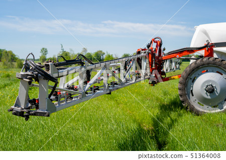 nozzles on the spray bar, against the background of the sprayer 51364008