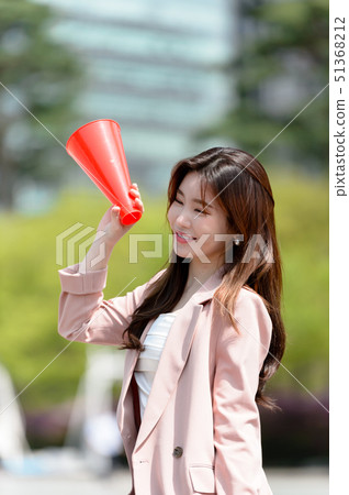 The expression of a Korean woman who is full of confidence, lifestyle, rest in a park 51368212