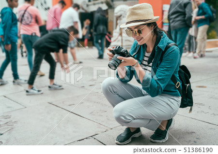 traveler taking photo handprints chinese theatre traveler taking photo handprints chinese theatre 51386190